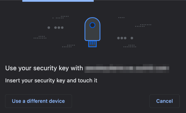 A digital interface displays a prompt for using a security key, featuring a simple USB key icon at the top. 
